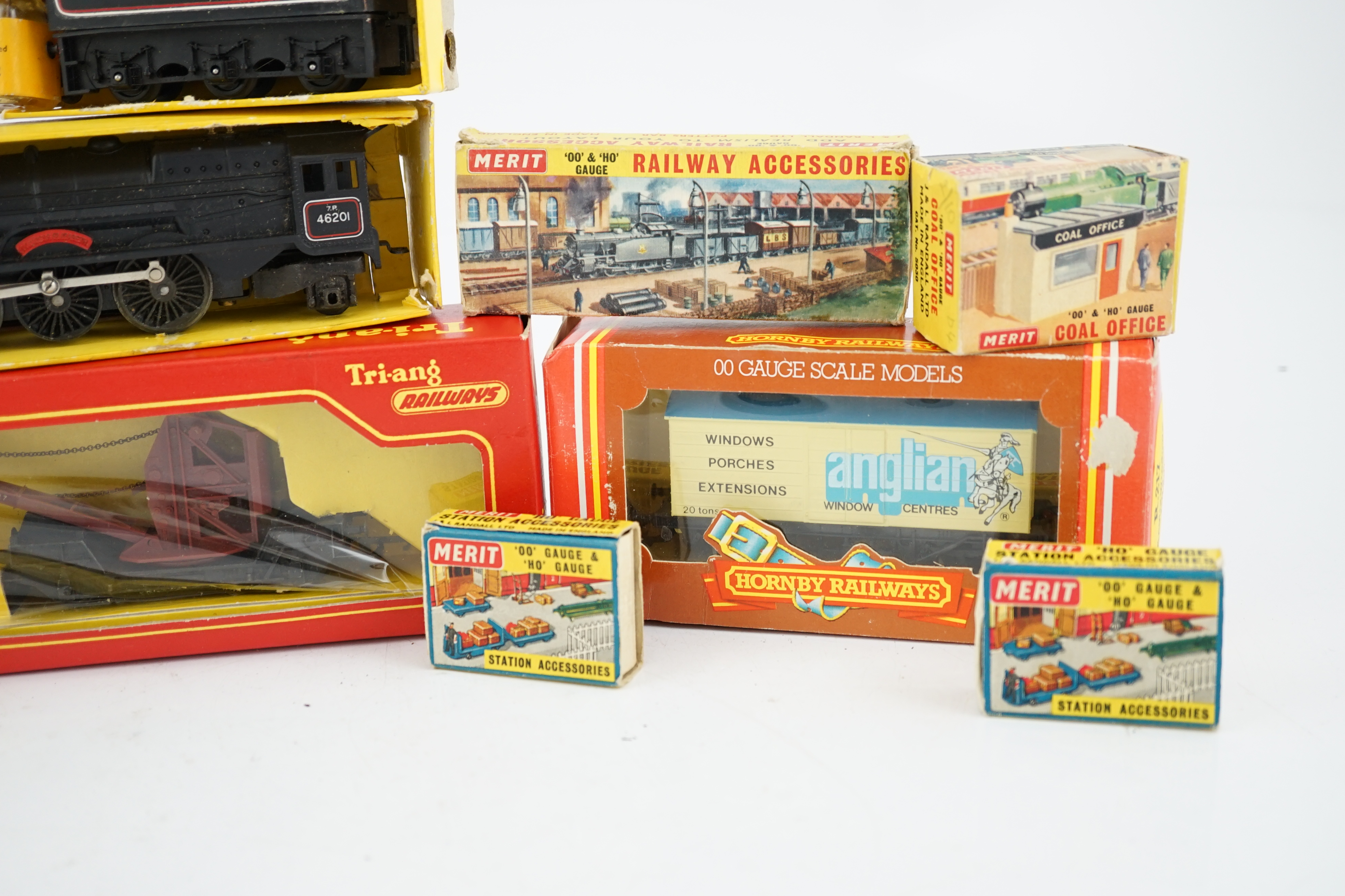 A collection of mostly Tri-ang Railways 00 gauge model railway, including three locomotives; a BR saddle tank loco (R153), a BR Princess Royal class 4-6-0 and an S.R. Suburban Motor Coach driving unit